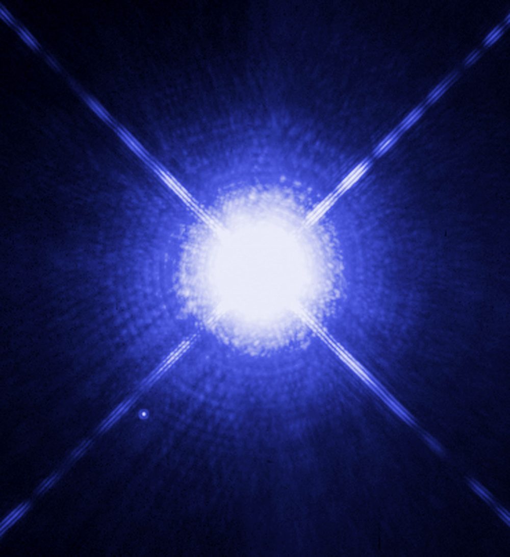 HST image: Sirius A with diffraction spikes and the faint companion Sirius B at lower left